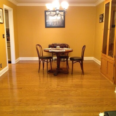 Nice Formal Dining Room Open to Great Room with Hardwood Flooring and Crown Molding!