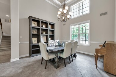 Formal dining room with two story ceiling and lots of natural light