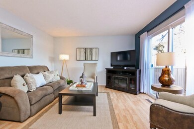 Nice-sized living room with sliding glass door to 
