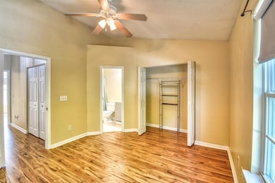 Unfurnished bedroom with a closet, a textured ceil