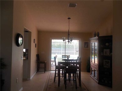 Dining Room. This dining area opens to the pool an