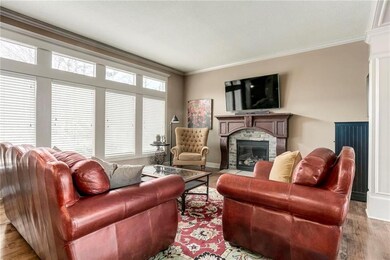 Sunlit Living Room with fireplace and gorgeous har