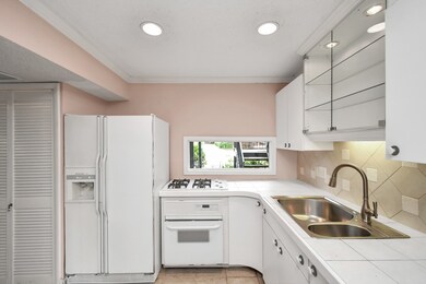 The kitchen features stunning tile countertops and