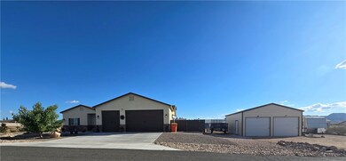 Ranch-style house with stucco siding, stone siding