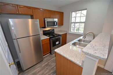 Kitchen with new appliances, sink, flooring and gr