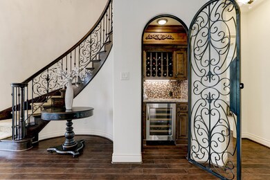 Your favorite libations are close at hand, thanks to this lovely wine room featuring beautiful cabinetry and a wine refrigerator.