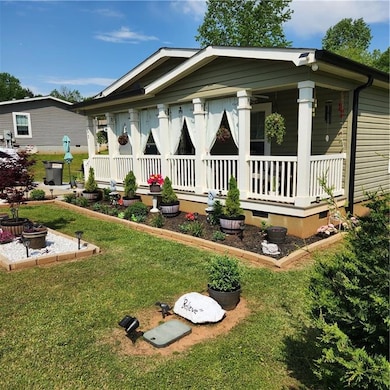 Bungalow-style home with covered porch and a front