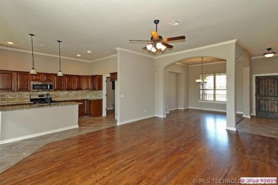 Hardwood floors run through dining room as well