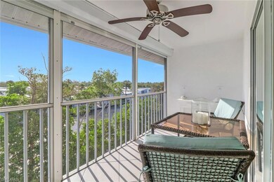 Sunroom with a balcony and a ceiling fan