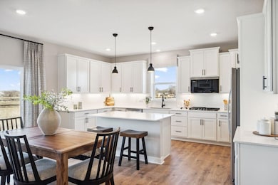 Welcome to the Jordan floor plan with the Signature kitchen! Photo is of previously built model home, finishes, selections, and colors may vary.