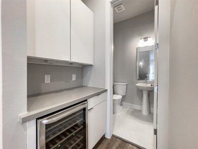 Second floor with beverage wine fridge and entranc