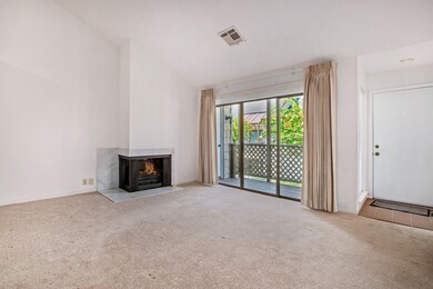 Entry with balcony and fireplace