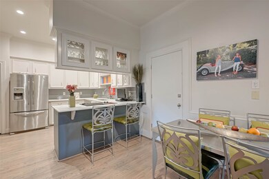 Spacious kitchen with display cabinets, breakfast