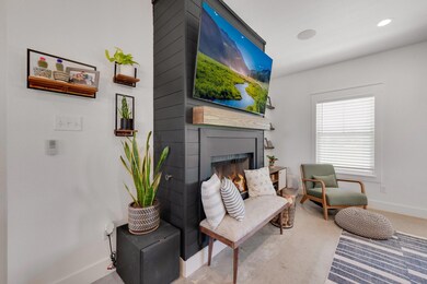 Living room featuring a large fireplace