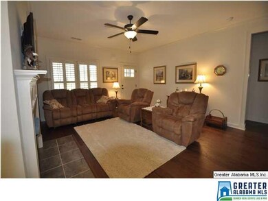 Family room with beautiful fireplace, hardwood tha