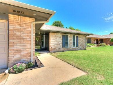 Doorway to property with a yard