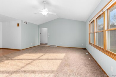 Living room looking from dining area towards hall.