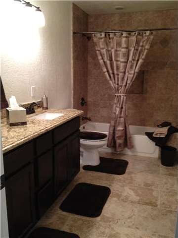 Full bathroom with double sinks