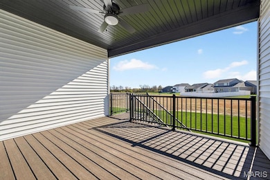 Deck featuring ceiling fan, a lawn, and a residential view