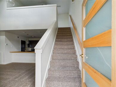 Stairway featuring carpet flooring