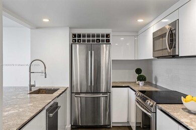 Designed for both style and functionality, this stunning open-concept kitchen is the heart of the home. The extra-large island serves as a focal point, providing ample prep space, additional storage, and a seamless connection to the spacious living area.