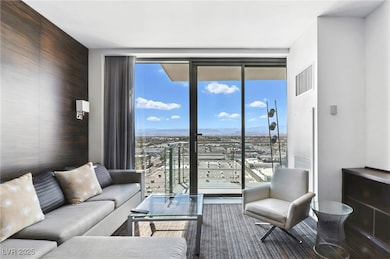 Living area with expansive windows and a mountain view