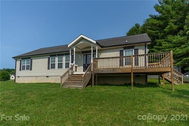 Deck connects front and side entrances.