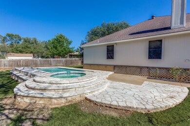 View of pool featuring a patio area, a fenced backyard, and a pool with connected hot tub