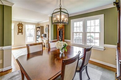 Dining room opens to living room and rear foyer an