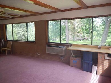 Sunroom. Windows galore in the sunroom.  Also ther