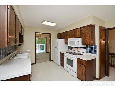 Kitchen features newer appliances, tiled floor & v