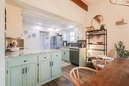 Kitchen featuring dark wood finished floors, light