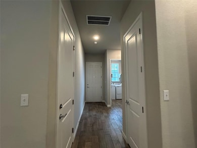 Hall with independent washer and dryer and dark w