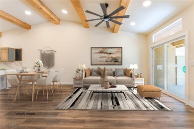 Living room with recessed lighting, a ceiling fan,