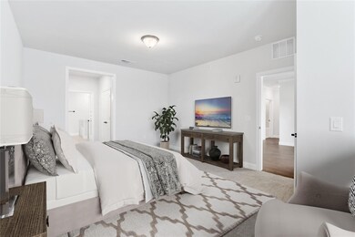 The primary bedroom is massive, with a sitting are