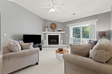 Living room with private entrance to wooded balcony