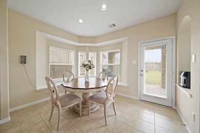 Breakfast room opens to the extended covered patio