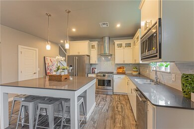 Kitchen with glass inlay upper cabinets