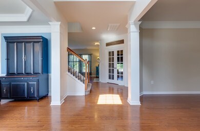 As you walk in, the large dining room is to your left and a sitting room is to your right 