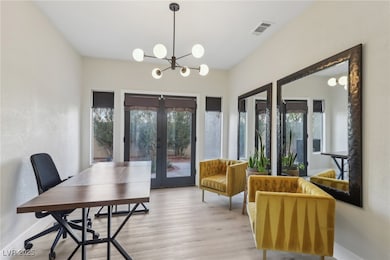 Dining area featuring french doors, visible vents,