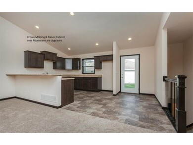 View of Kitchen and Stairway to Lower Level
