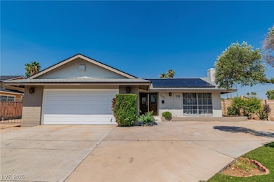 Ranch-style house featuring brick siding, driveway