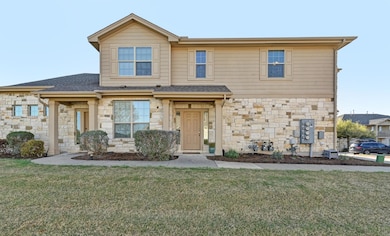 Multi unit property featuring stone siding, a shi