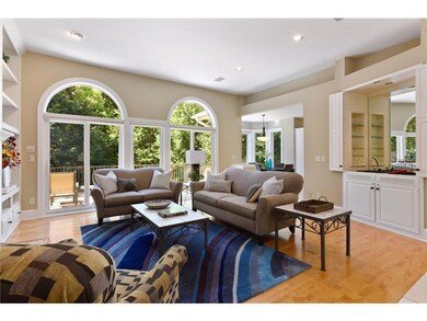 Living room with cozy fireplace, wet bar and acces