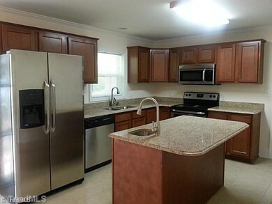 Kitchen. Stainless steel appliances, kitchen island & granite tops! Island has oversized top for stools.