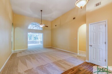 Living Room leading to Sun Room behind