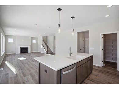 The stunning gourmet kitchen features a double wal