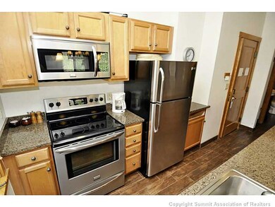 Kitchen. New stainless appliances and gorgeous til