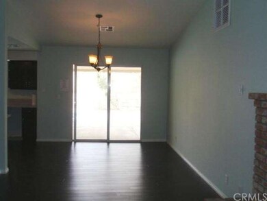 Dining Area next to Kitchen.  Sliding doors to Bac