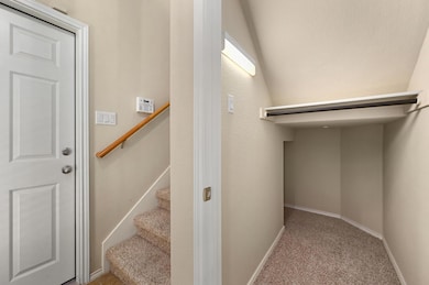 Stairway featuring carpet and baseboards